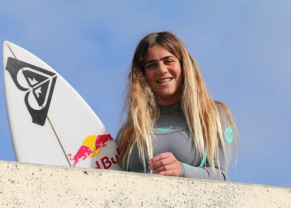 Photo of team rider Caroline Marks with surfboard