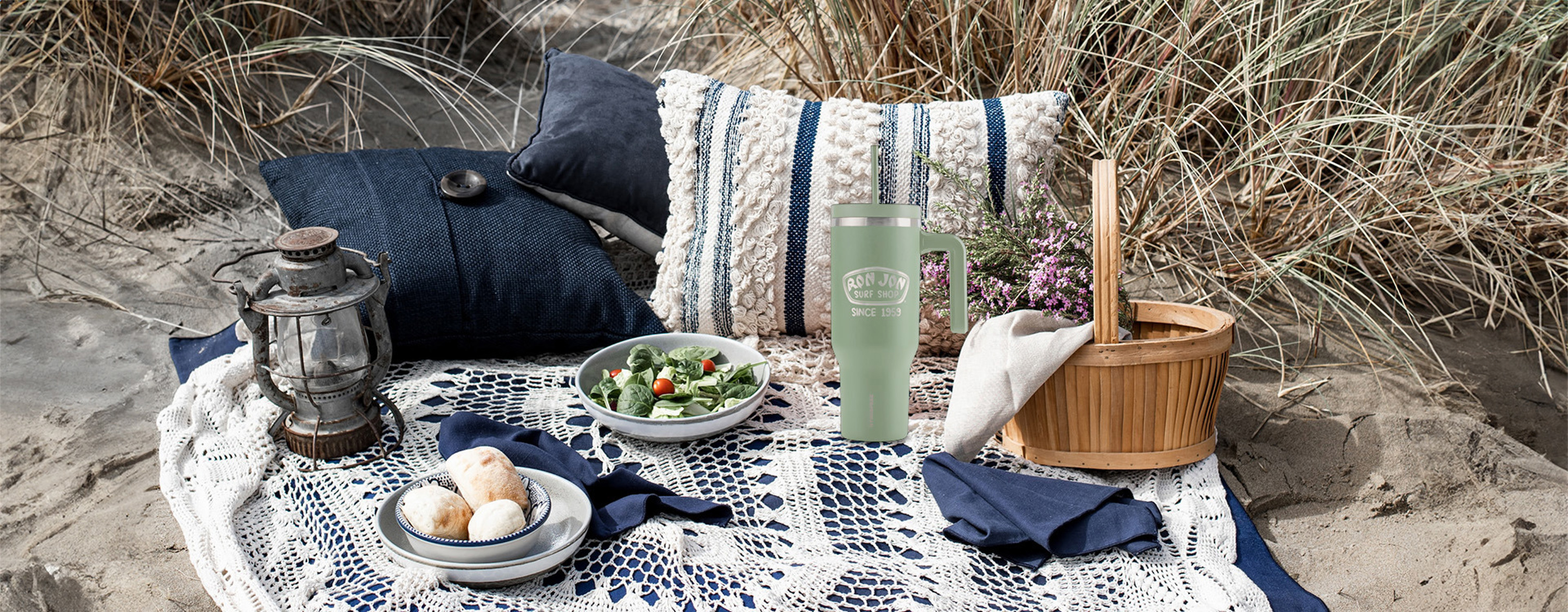 beach picnic with 40 ounce tumbler in the middle