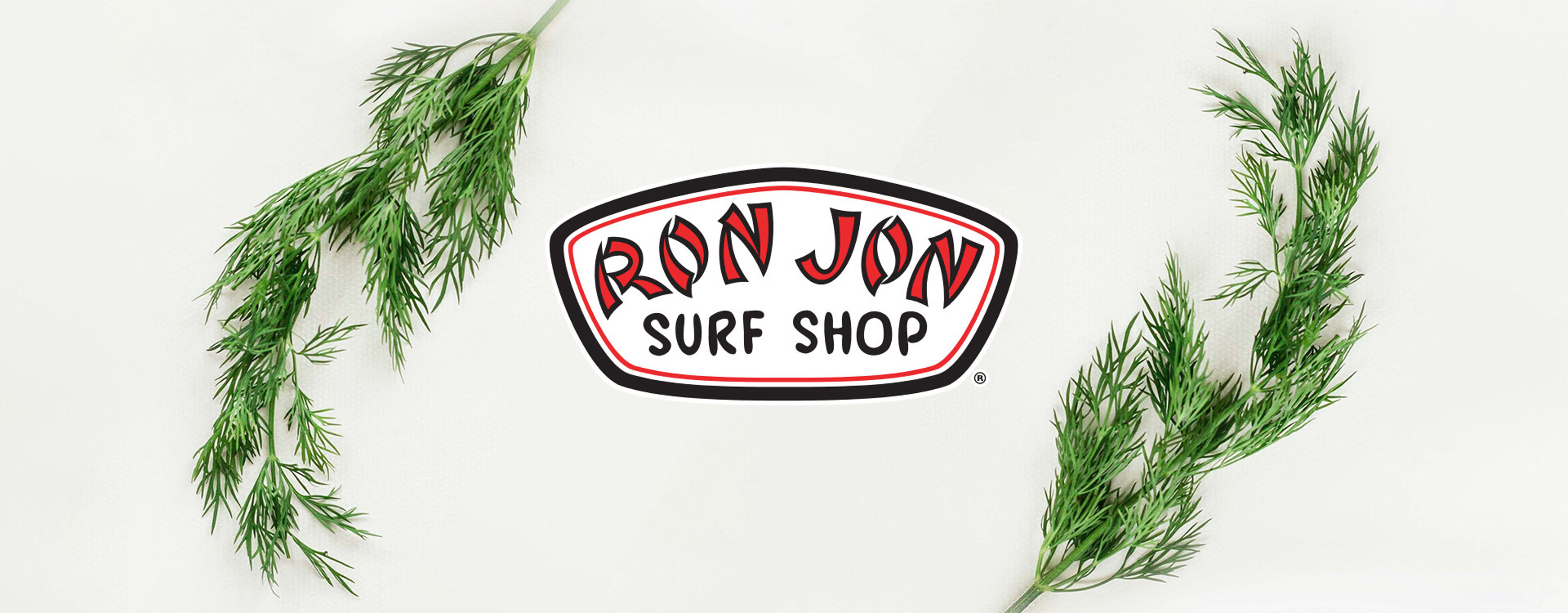 ron jon logo with pine branches on either side