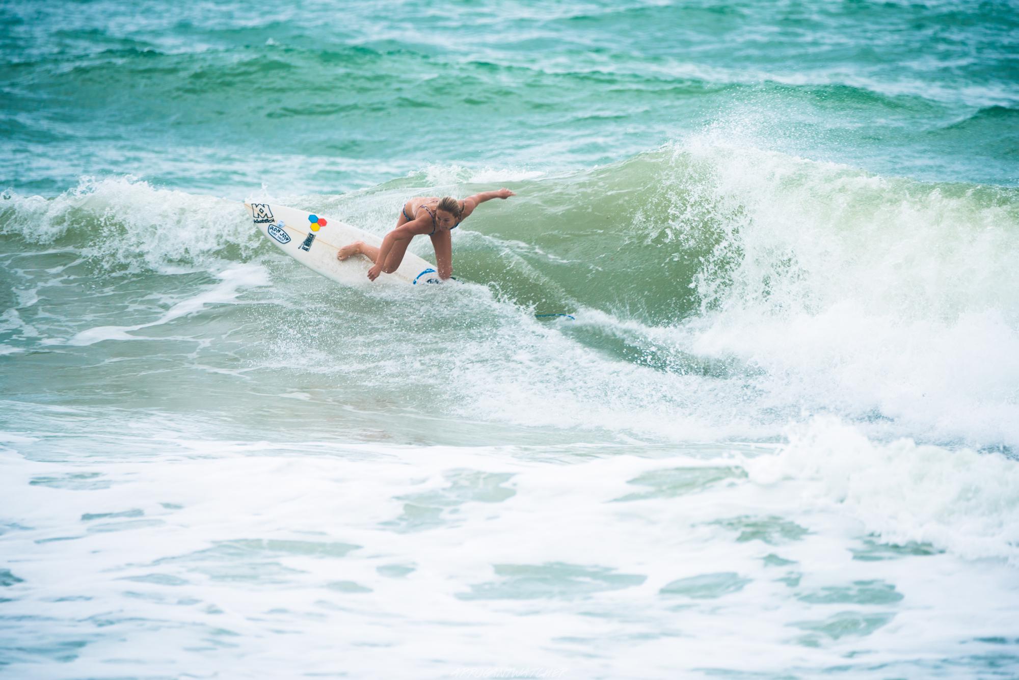 Photo of team rider Lauren McLean surfing